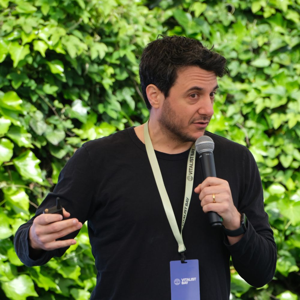 Vitalist Bay 2025 - Speaker presenting on stage